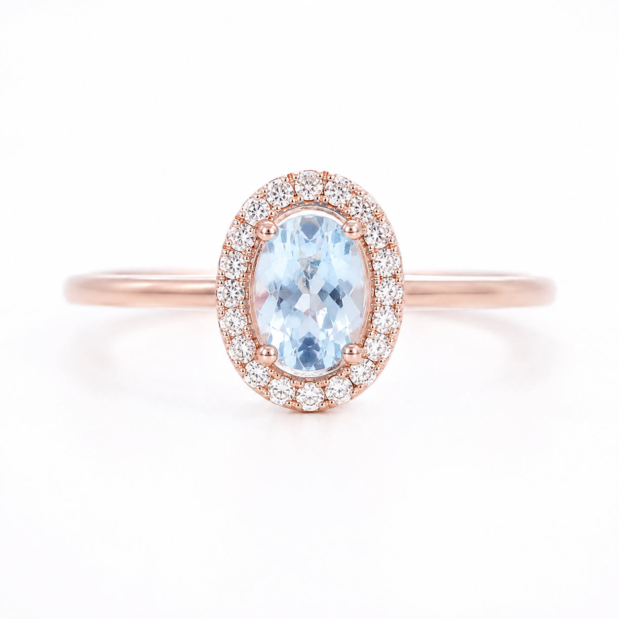 Natural 4x6mm oval aquamarine halo ring with cubic zirconia accents in sterling silver