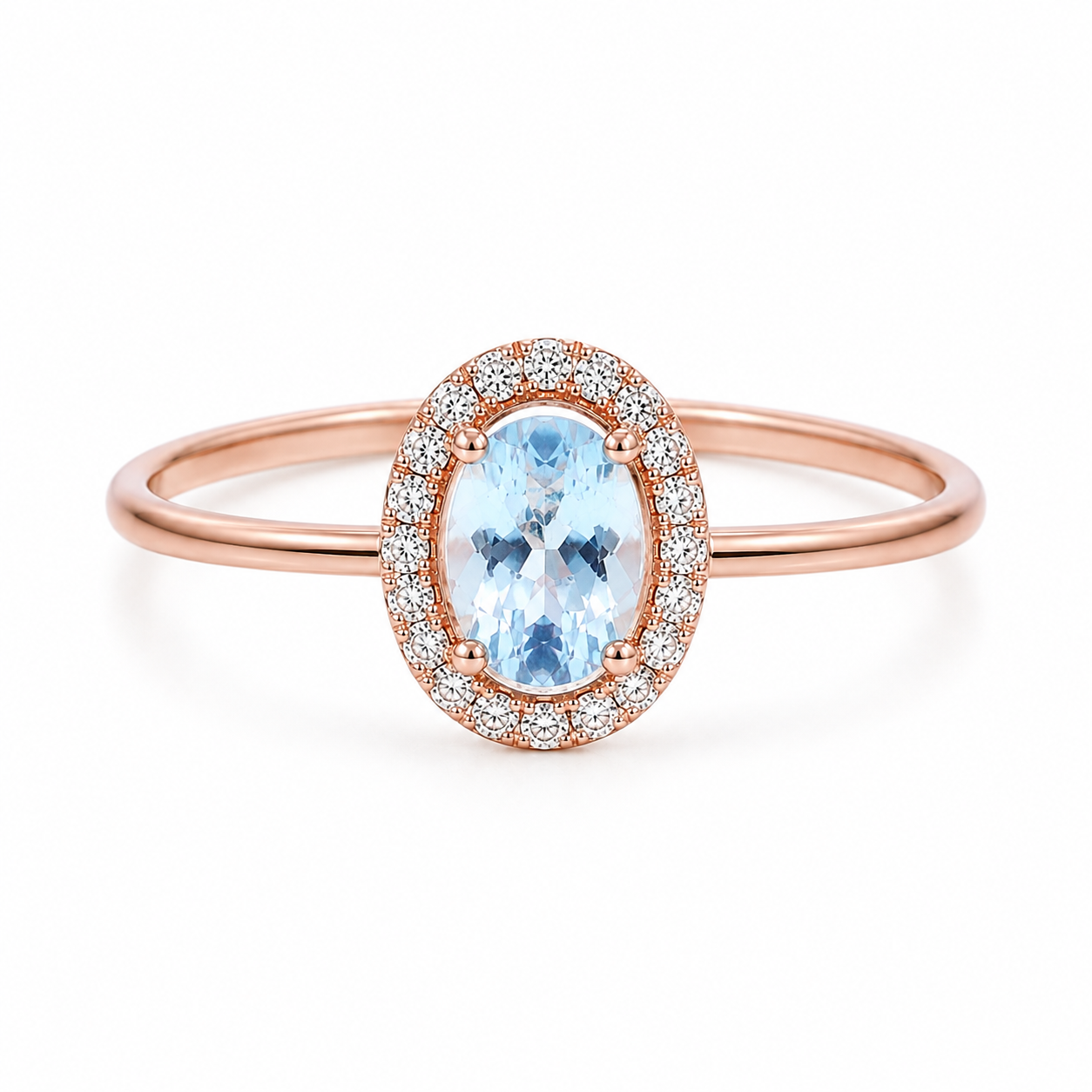 Top view of natural 4x6mm oval aquamarine halo ring with sparkling CZ accents