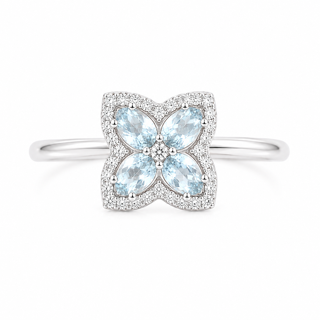 Top view of 4x5mm natural aquamarine floral gemstone ring with cubic zirconia accents