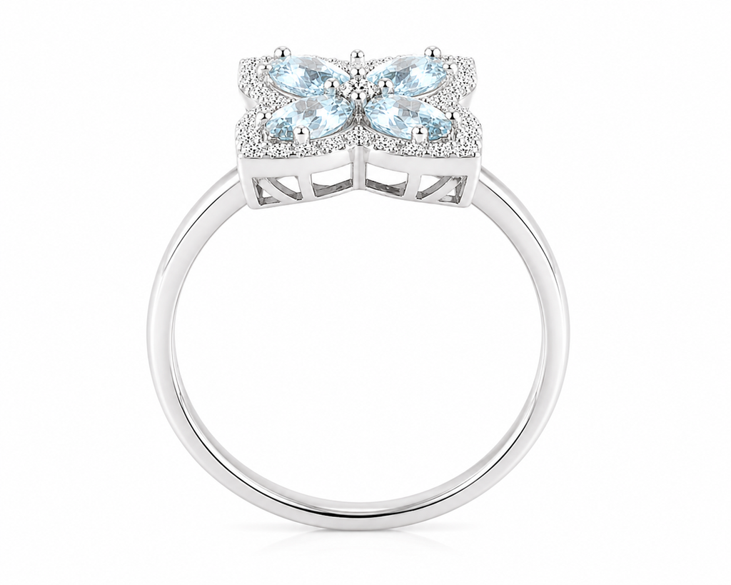 Side profile of natural aquamarine flower ring featuring four 4x5mm gemstones