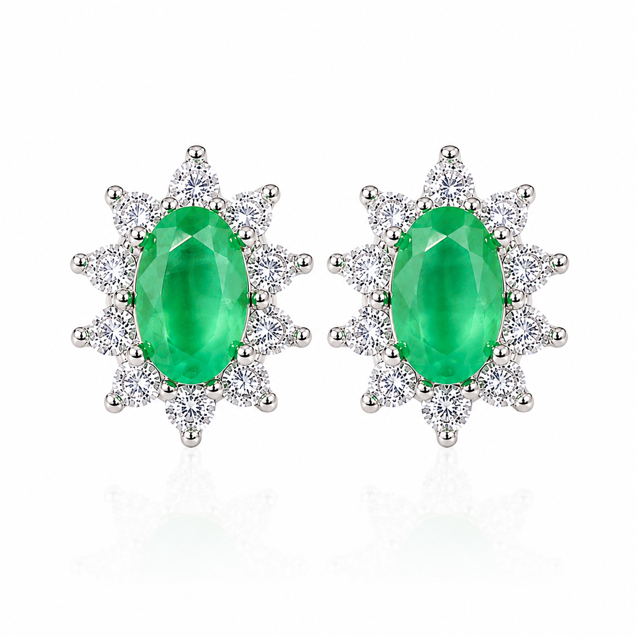 Natural 3x5mm oval emerald stud earrings in 925 sterling silver with sparkling cubic zirconia cluster accents