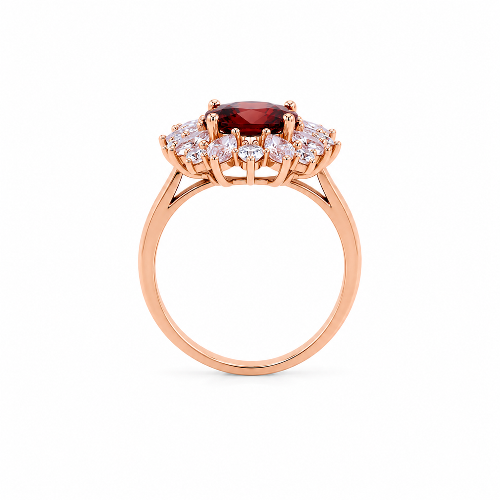 Natural 7x9mm oval red garnet halo ring featuring brilliant cubic zirconia accents in a rose gold plated sterling silver setting.