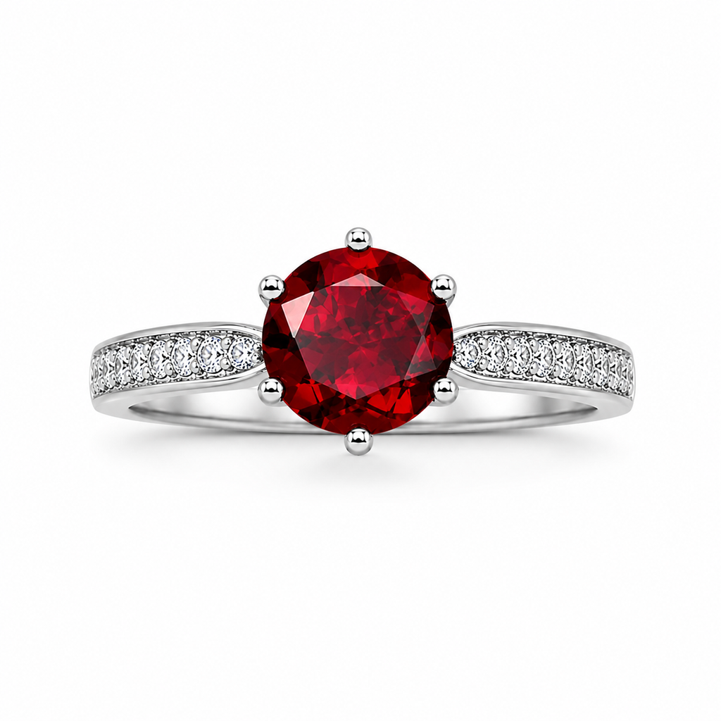 Natural 8mm round red garnet solitaire ring with cubic zirconia pavé shoulder accents in platinum plated sterling silver on a white background