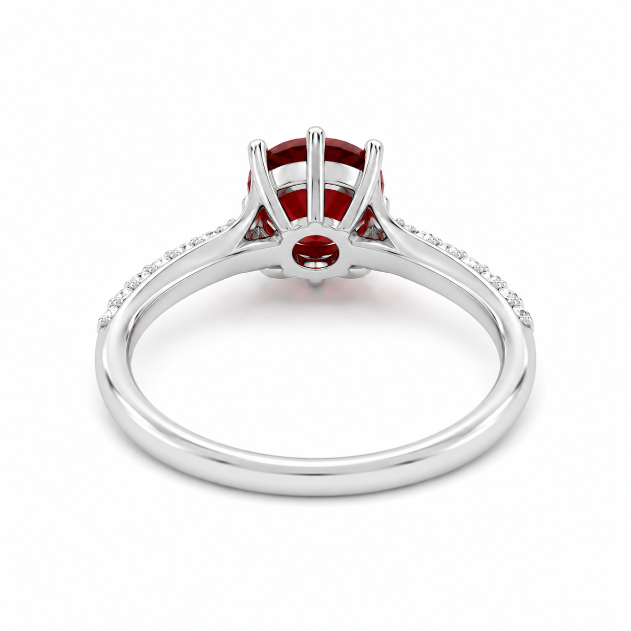 Natural 8mm round red garnet solitaire ring with cubic zirconia pavé shoulder accents in platinum plated sterling silver on a white background