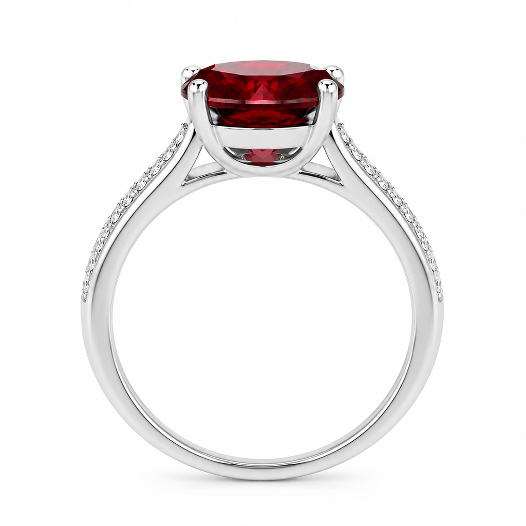 Natural 8mm round red garnet solitaire ring with cubic zirconia pavé shoulder accents in platinum plated sterling silver on a white background