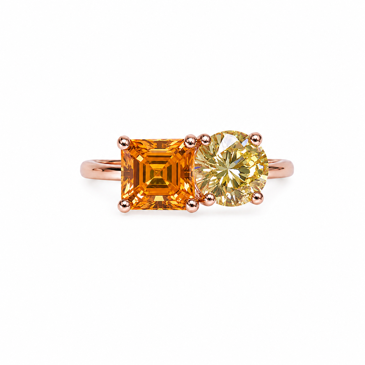 Two stone yellow moissanite ring featuring Asscher cut and round brilliant cut gemstones in rose gold plated 925 sterling silver on a white background