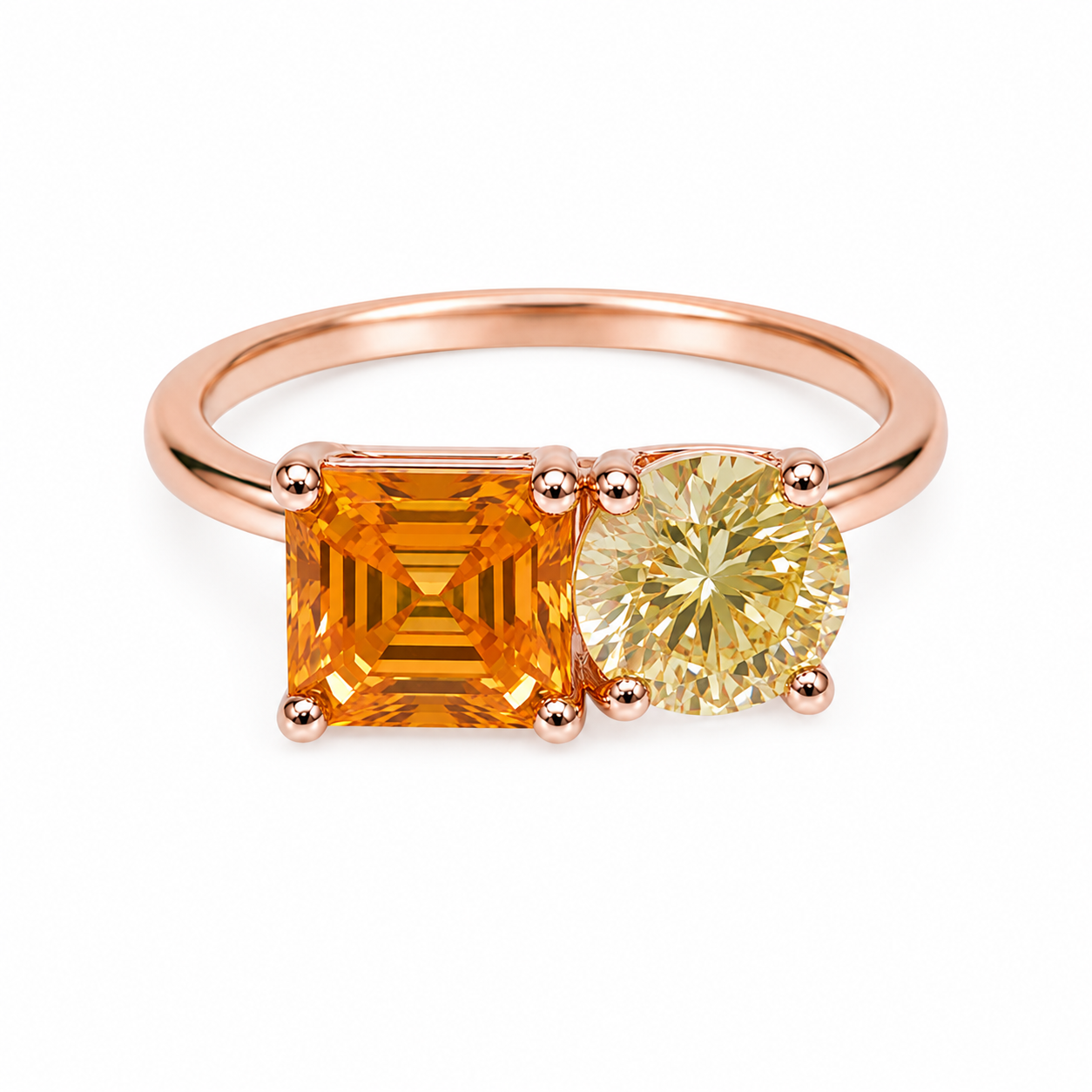 Two stone yellow moissanite ring featuring Asscher cut and round brilliant cut gemstones in rose gold plated 925 sterling silver on a white background
