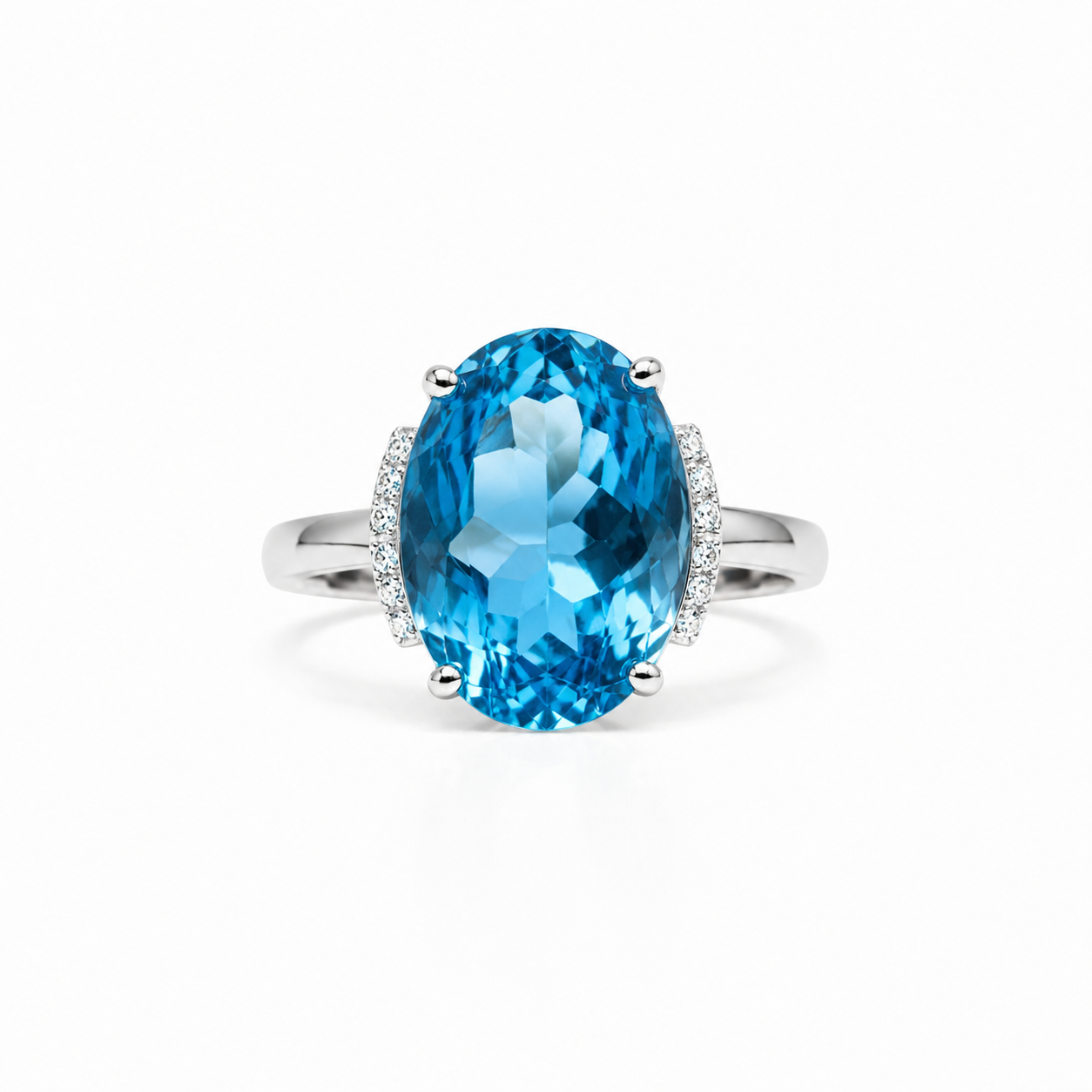 Natural Swiss Blue Topaz ring featuring a 12x16mm oval gemstone with cubic zirconia accents in platinum-plated sterling silver.