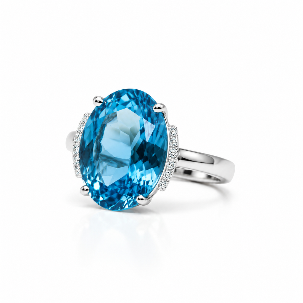 Natural Swiss Blue Topaz ring featuring a 12x16mm oval gemstone with cubic zirconia accents in platinum-plated sterling silver.