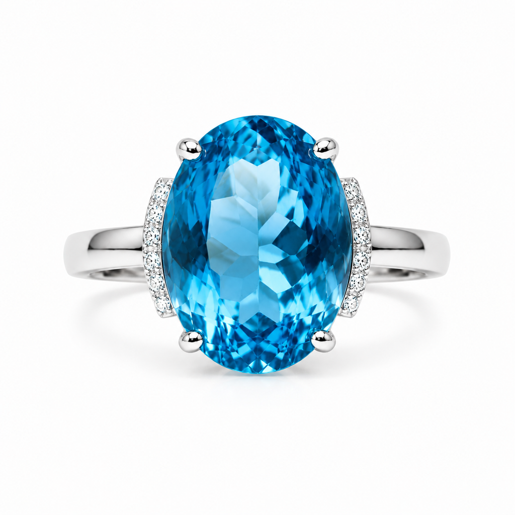 Natural Swiss Blue Topaz ring featuring a 12x16mm oval gemstone with cubic zirconia accents in platinum-plated sterling silver.