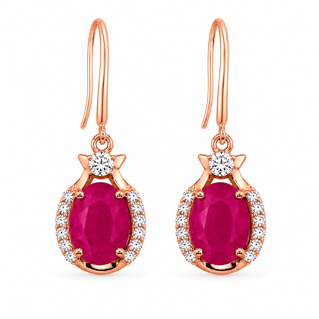 Natural bright pink opaque ruby drop earrings with 6x8mm oval gemstones, cubic zirconia halo, platinum plated 925 sterling silver on a white background.