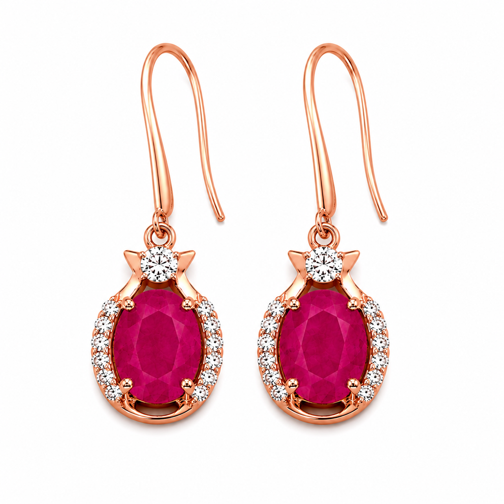 Natural bright pink opaque ruby drop earrings with 6x8mm oval gemstones, cubic zirconia halo, platinum plated 925 sterling silver on a white background.