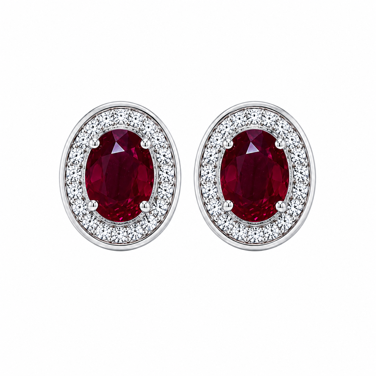Natural 4x6mm oval ruby halo stud earrings in platinum plated 925 sterling silver with sparkling cubic zirconia on a white background.