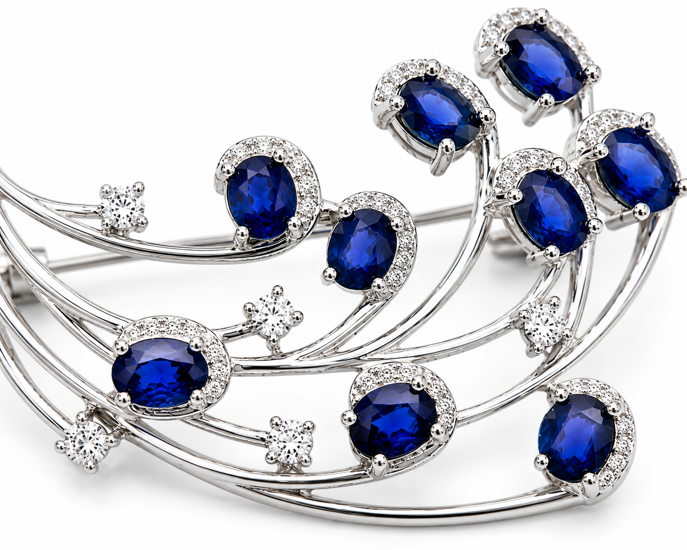 Natural Blue Sri Lanka Sapphire Brooch Pin in 925 Sterling Silver featuring nine 4x5 mm oval natural sapphires with cubic zirconia accents