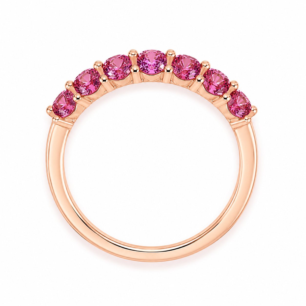 Natural Pink Garnet half eternity ring featuring seven genuine 3mm round pink garnets in rose gold plated 925 sterling silver on a white background.