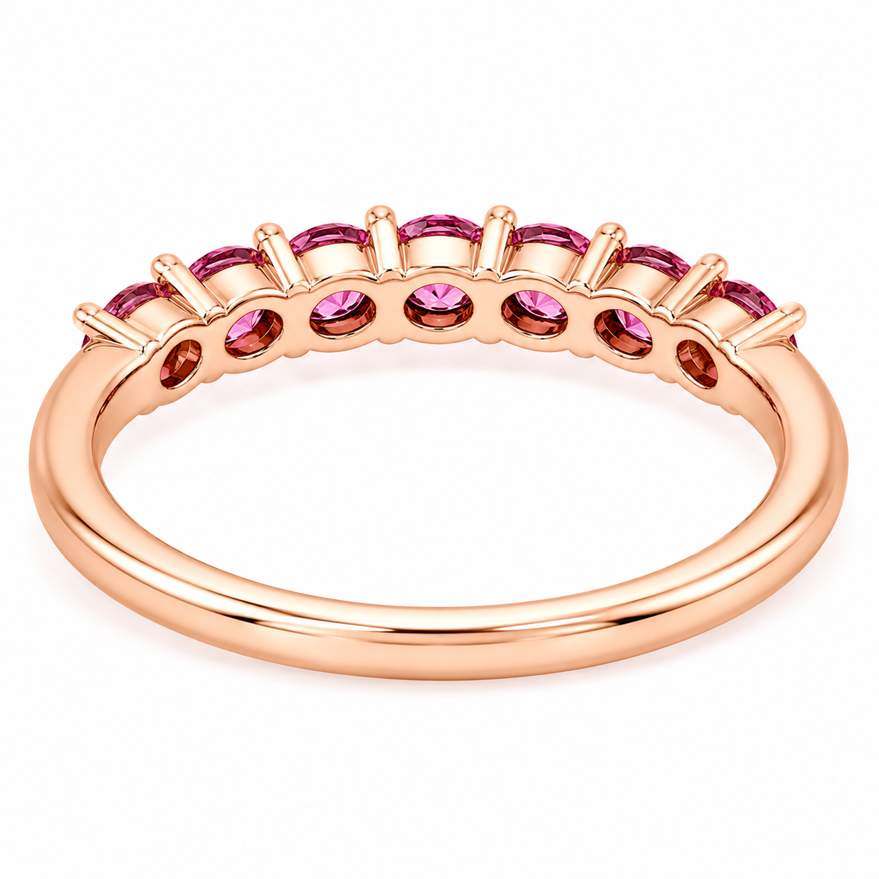 Natural Pink Garnet half eternity ring featuring seven genuine 3mm round pink garnets in rose gold plated 925 sterling silver on a white background.