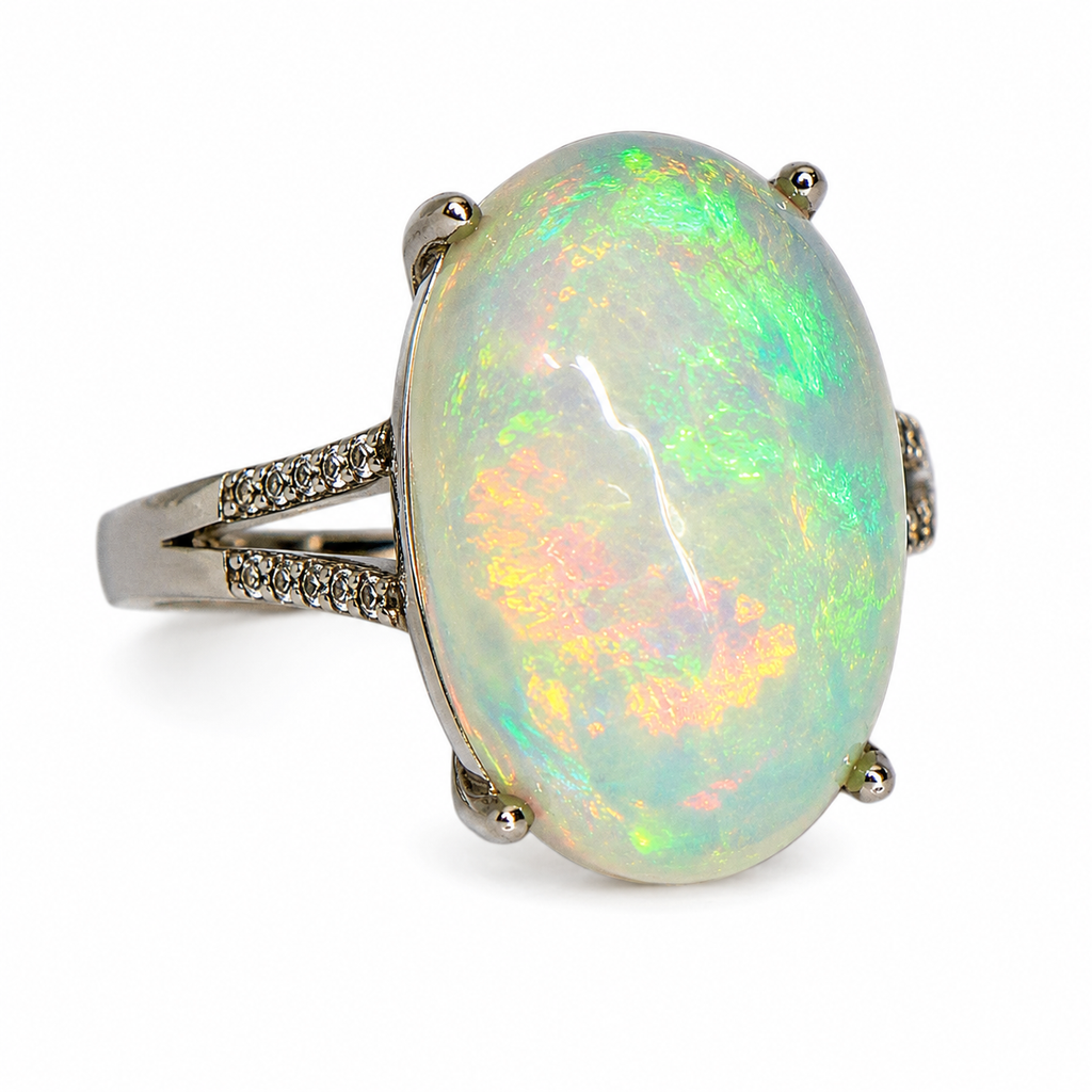 Natural Australian White Opal ring featuring a hand-selected 10–15 carat genuine opal in a sterling silver setting with cubic zirconia accents.