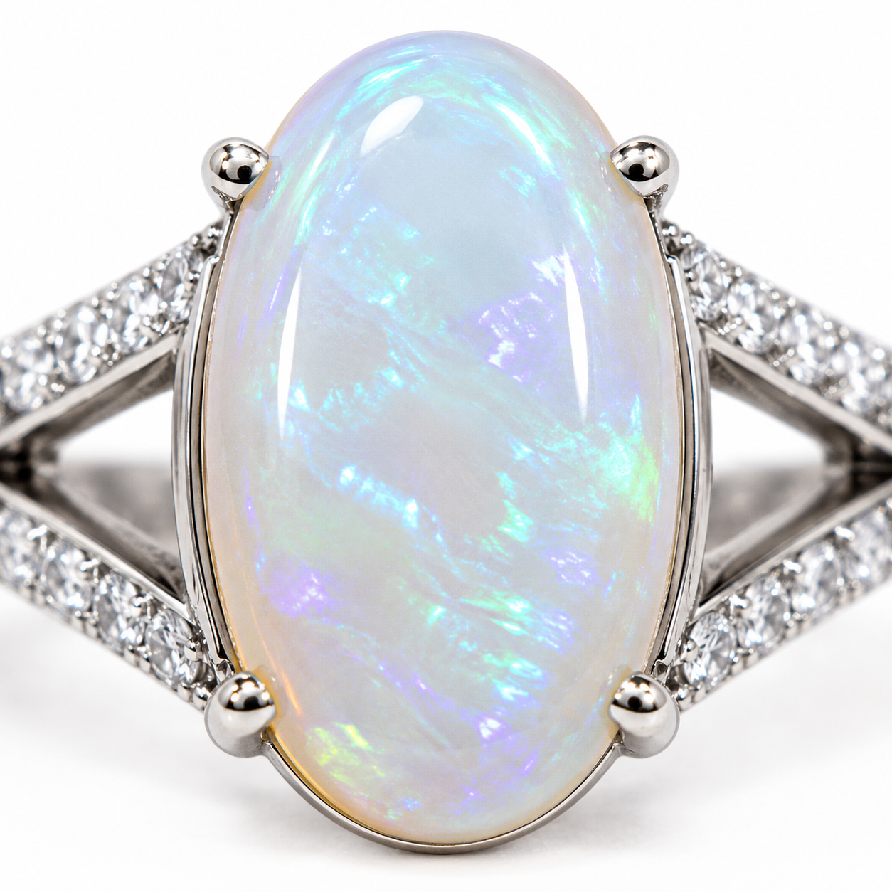 Natural Australian White Opal ring featuring a hand-selected 10–15 carat genuine opal in a sterling silver setting with cubic zirconia accents.