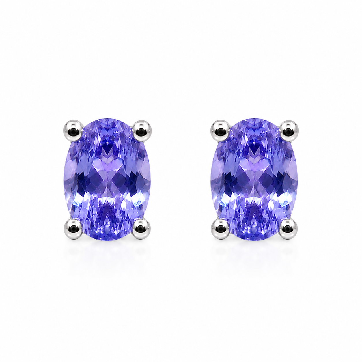 Natural Purple Tanzanite Halo Stud Earrings featuring 4x6mm oval genuine tanzanite gemstones in 925 sterling silver with sparkling cubic zirconia by Phimsera.
