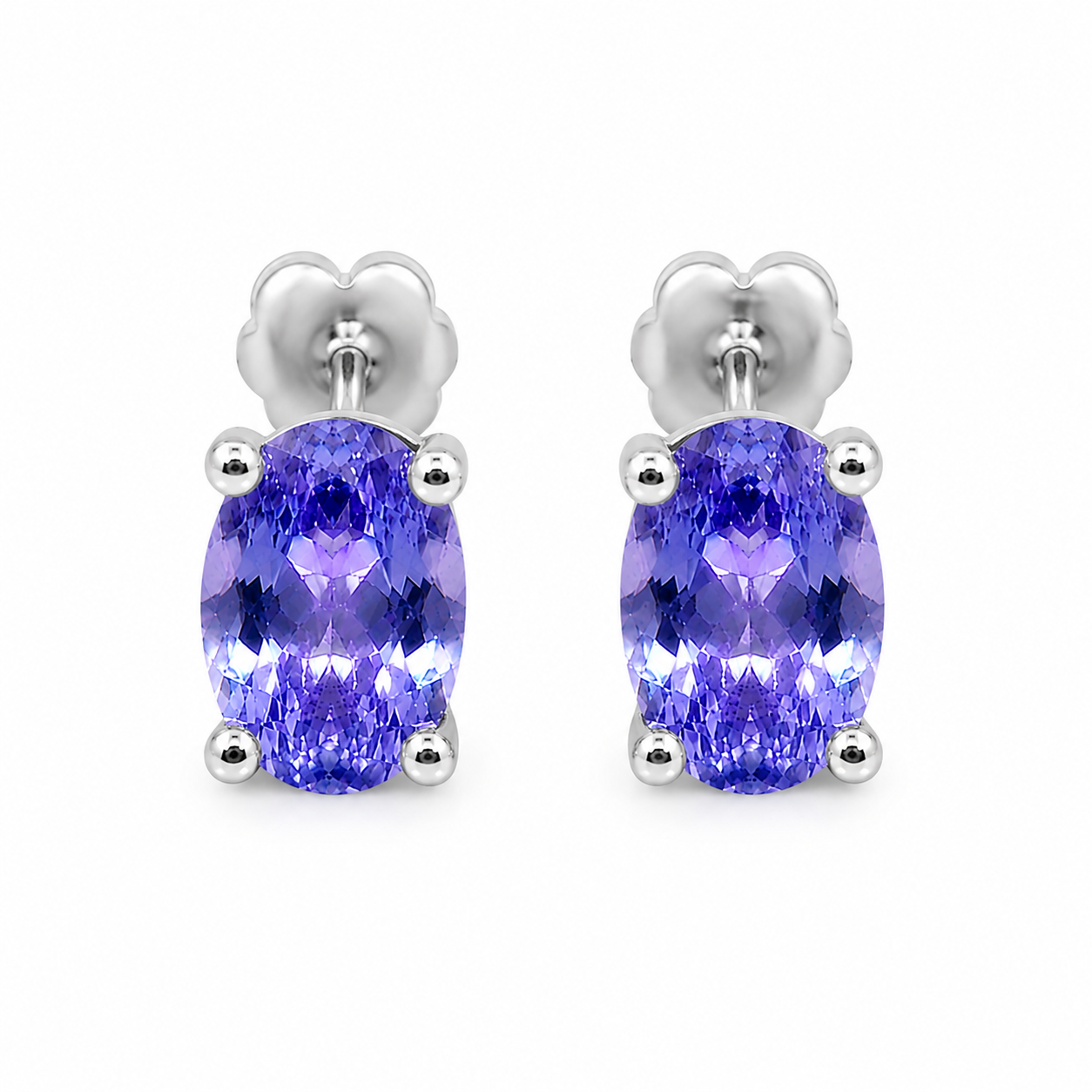 Natural Purple Tanzanite Halo Stud Earrings featuring 4x6mm oval genuine tanzanite gemstones in 925 sterling silver with sparkling cubic zirconia by Phimsera.