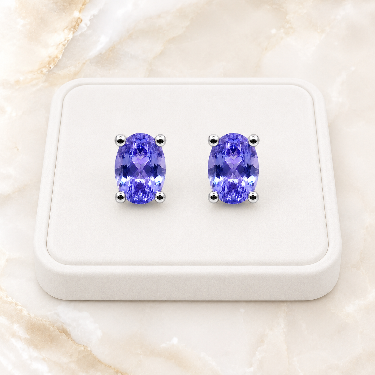 Natural Purple Tanzanite Halo Stud Earrings featuring 4x6mm oval genuine tanzanite gemstones in 925 sterling silver with sparkling cubic zirconia by Phimsera.