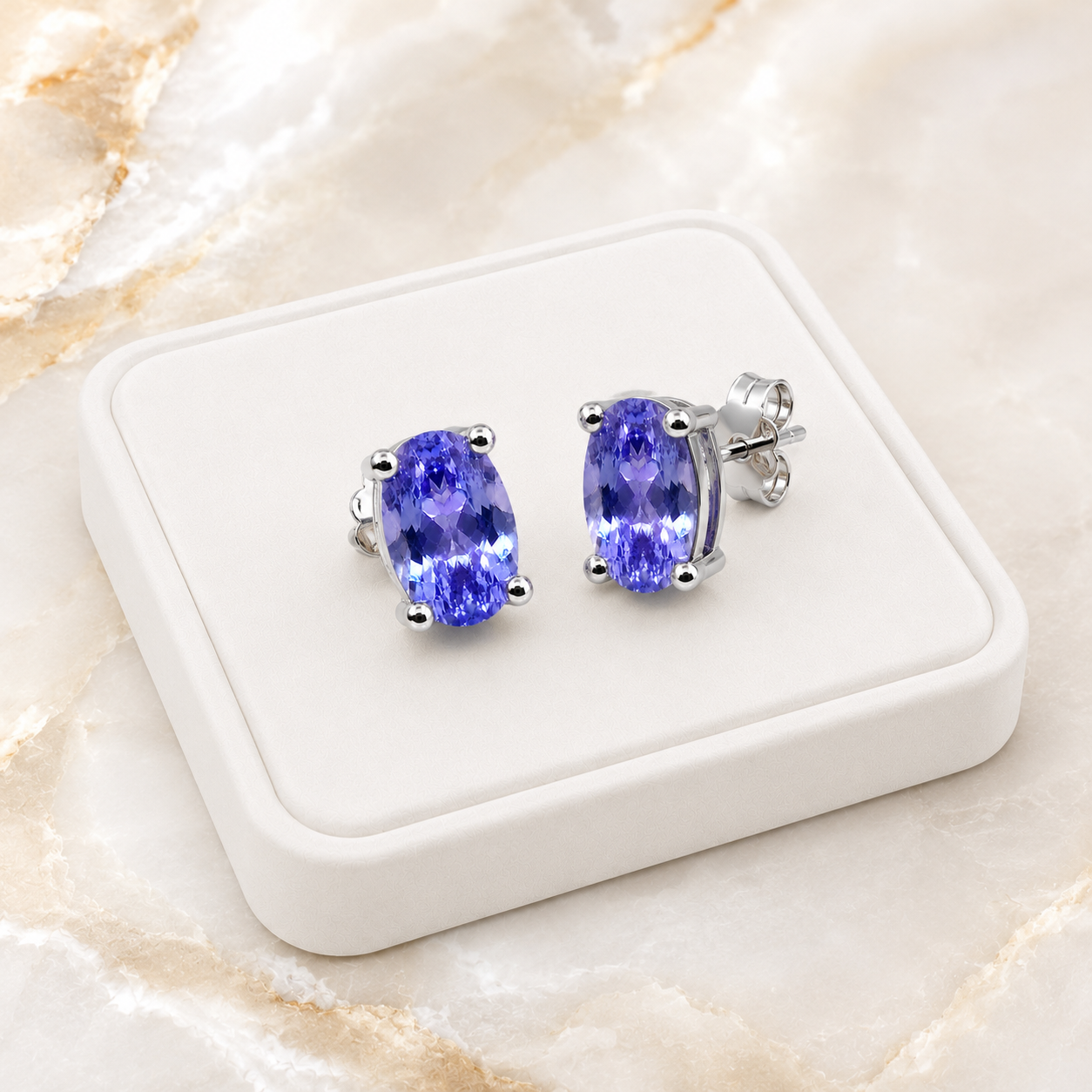 Natural Purple Tanzanite Halo Stud Earrings featuring 4x6mm oval genuine tanzanite gemstones in 925 sterling silver with sparkling cubic zirconia by Phimsera.