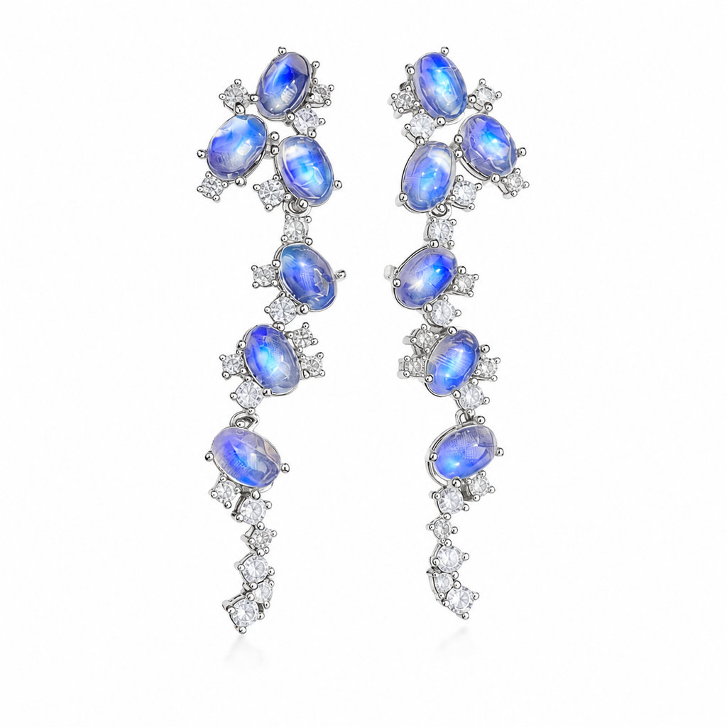 Natural Blue Moonstone stud earrings featuring genuine 4x6mm oval moonstones surrounded by high quality cubic zirconia in 925 sterling silver.