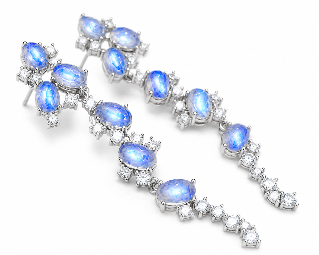 Natural Blue Moonstone stud earrings featuring genuine 4x6mm oval moonstones surrounded by high quality cubic zirconia in 925 sterling silver.
