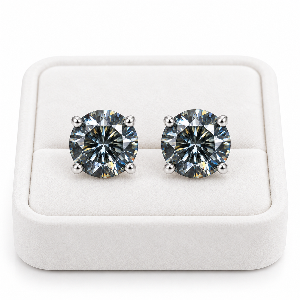 1 carat each gray moissanite stud earrings displayed on a white velvet jewelry tray