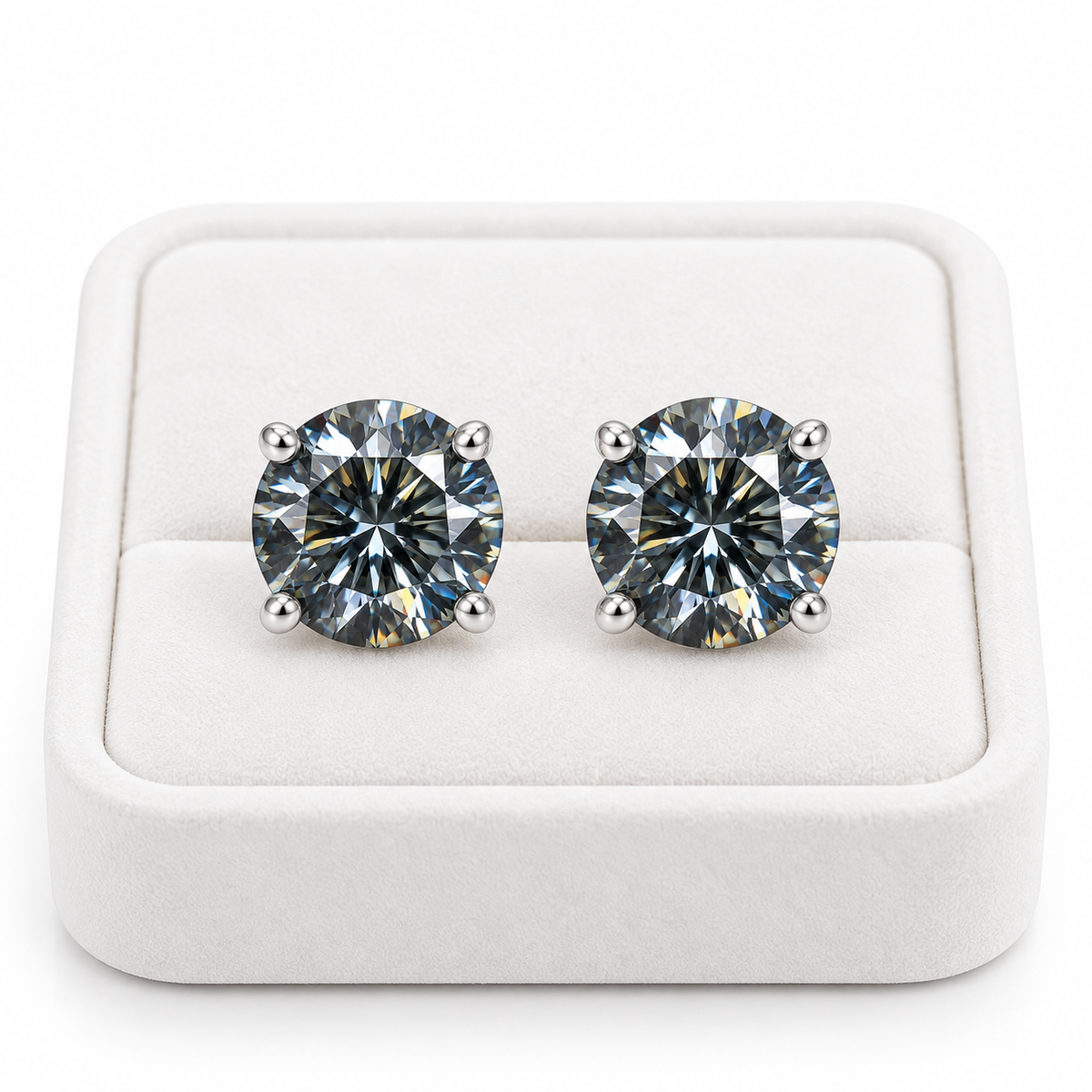 1 carat each gray moissanite stud earrings displayed on a white velvet jewelry tray