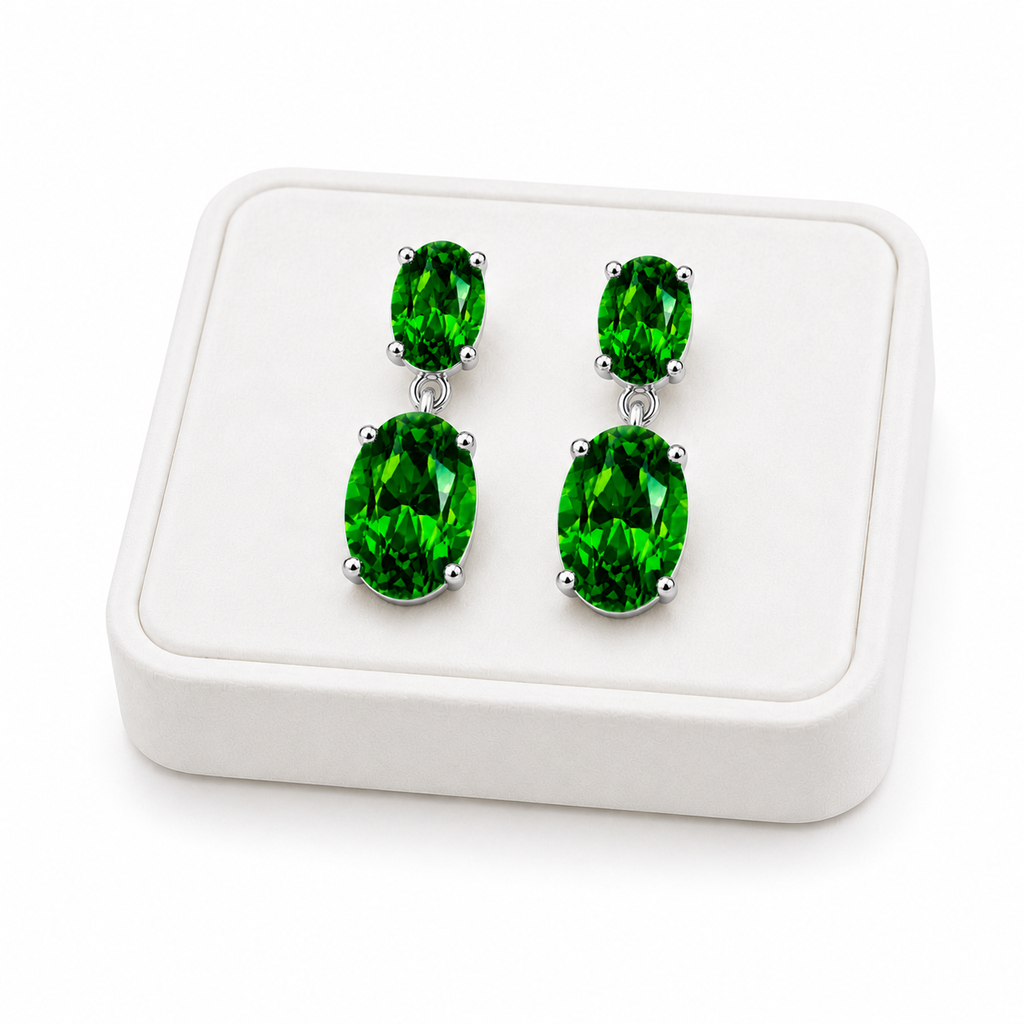 Natural Chrome Diopside dangle earrings displayed on a white velvet jewelry tray