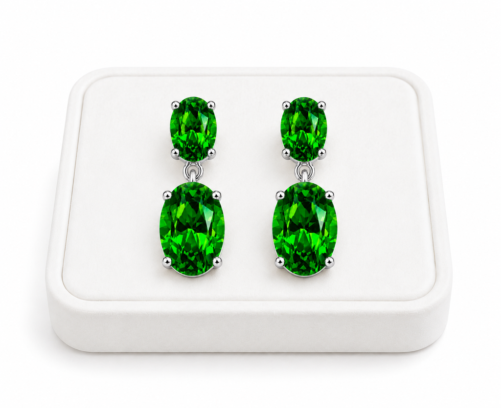 Natural Chrome Diopside dangle earrings displayed on a white velvet jewelry tray