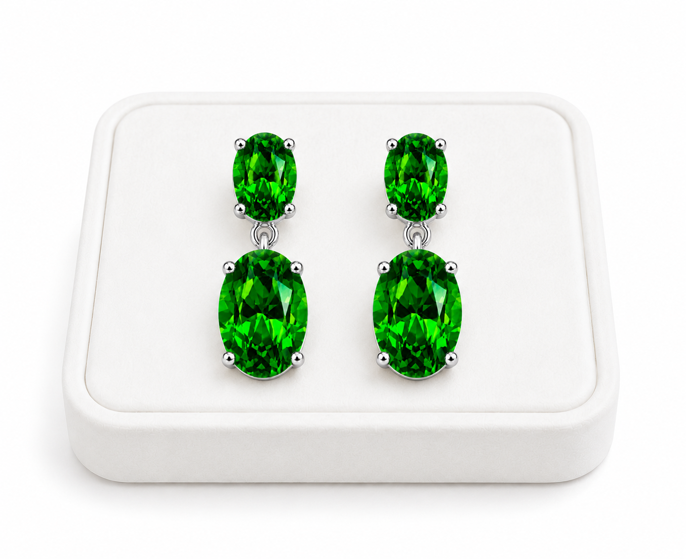 Natural Chrome Diopside dangle earrings displayed on a white velvet jewelry tray