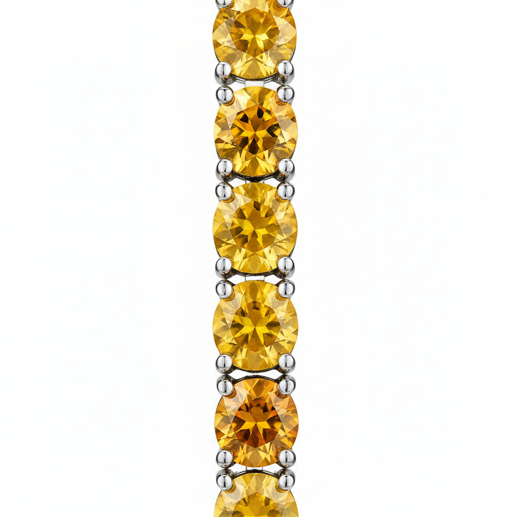  Macro view of 3mm round golden citrine gemstones in Phimsera sterling silver dangle earrings 