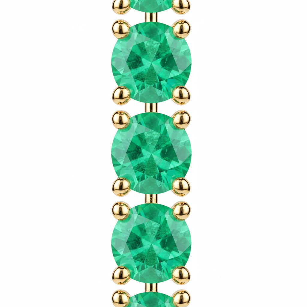 Macro view of 3mm round green emerald gemstones in Phimsera sterling silver dangle earrings