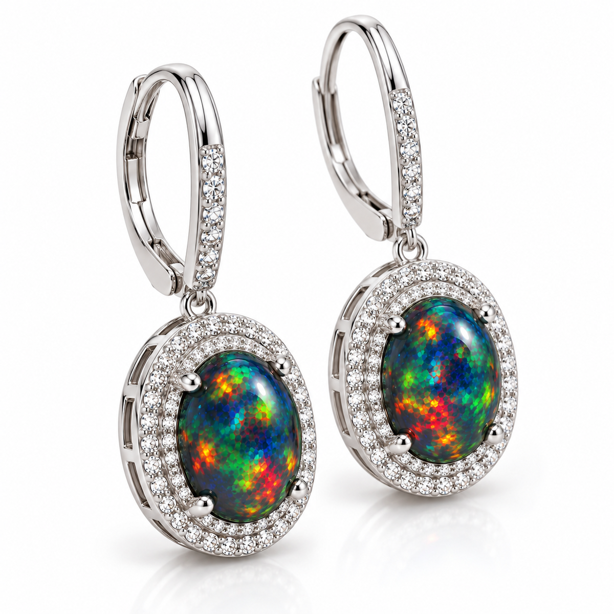 8x10mm natural black fire opal drop earrings shown at an angle with sterling silver halo setting