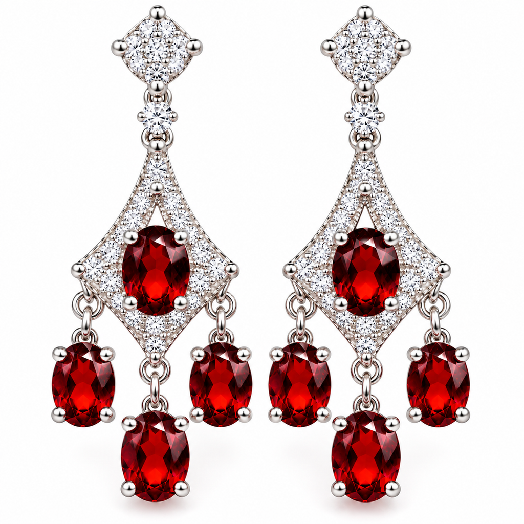A pair of silver-tone dangle earrings featuring oval-cut deep red gemstones and pavé-set clear stones, shown on a plain white background.