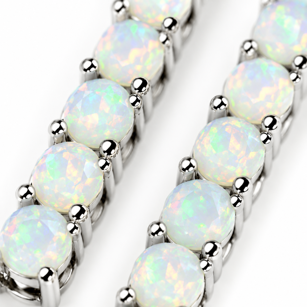 Macro view of natural 3mm round fire opal gemstones showing translucent bodies with green, yellow, orange and subtle pink play-of-color