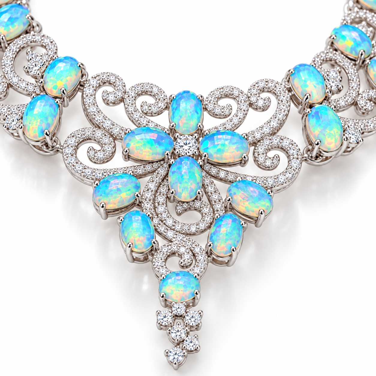 Close-up of blue green 3x4mm fire opal gemstones and sterling silver filigree