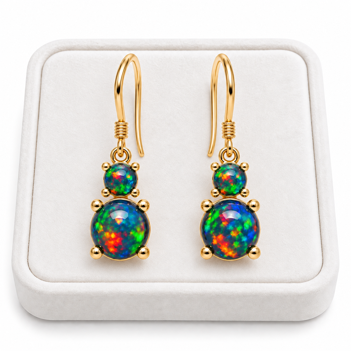 Natural Australian Black Opal drop earrings displayed on a Phimsera white velvet jewelry tray