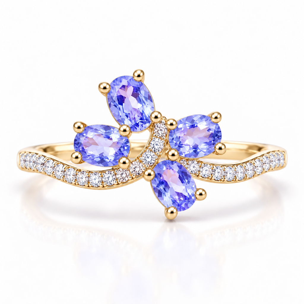 Natural purple tanzanite ring with four 3×4mm oval gemstones in an elegant floral-inspired design on a white background