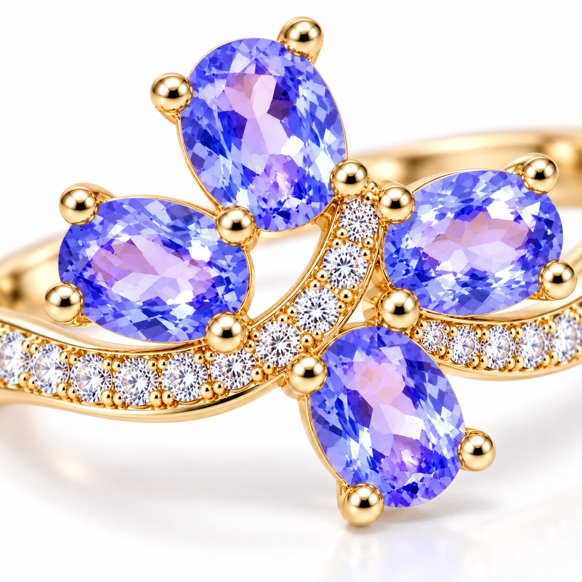 Macro close-up of natural purple tanzanite ring showing four 3×4mm faceted gemstones and detailed accent stones