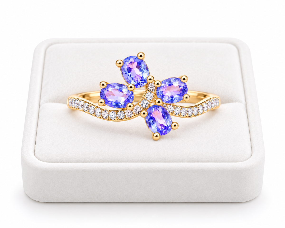 Natural purple tanzanite ring displayed on a premium white velvet jewelry tray