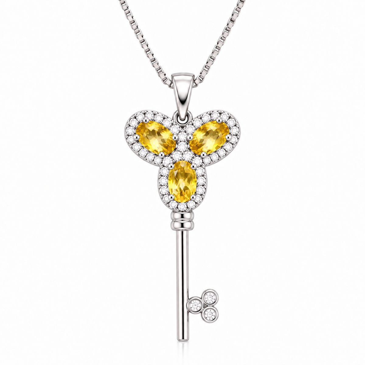 Natural citrine gemstone key necklace with three 3x5mm golden-yellow citrine gemstones in 925 Sterling Silver by Phimsera, Heavenly Key of Love and Peace design on a white background.