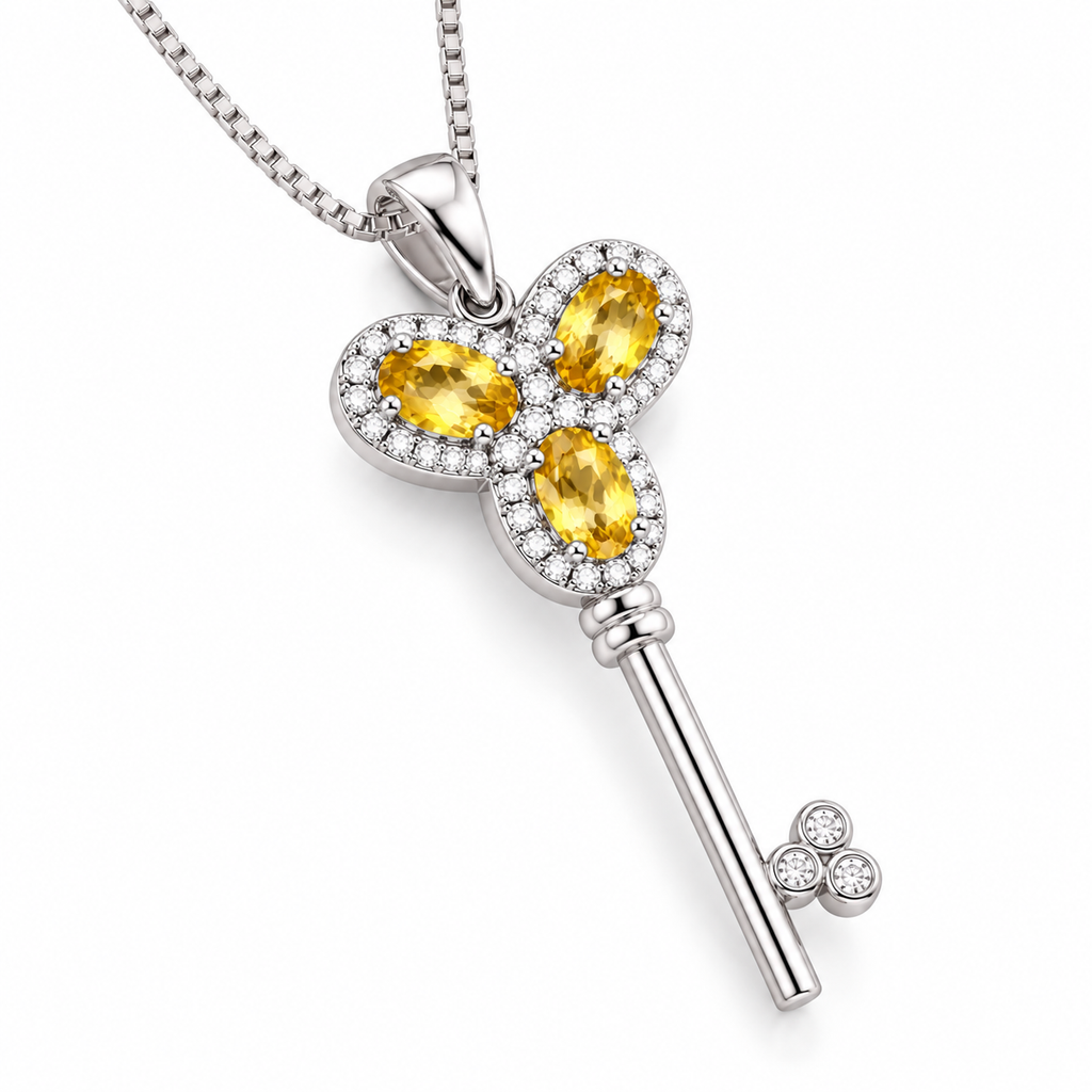 45-degree view of the Phimsera Heavenly Key of Love and Peace necklace featuring three natural 3x5mm citrine gemstones, 925 Sterling Silver, and a key-inspired pendant design.