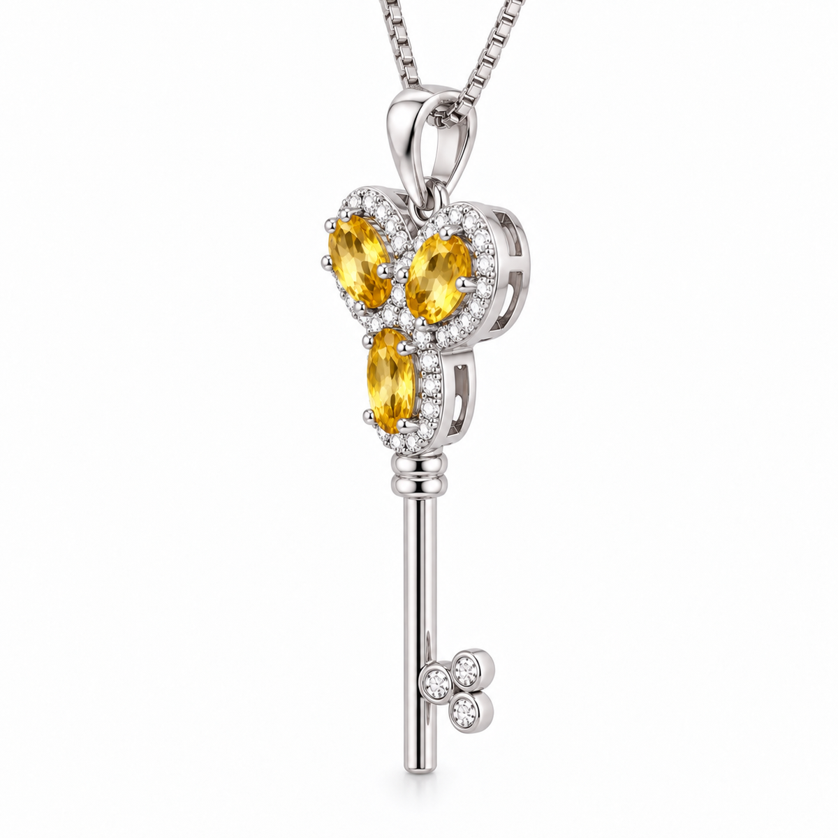 Side profile of the Phimsera natural citrine gemstone key-inspired necklace showing the three 3x5mm citrine gemstones, pendant depth, and 925 Sterling Silver setting.
