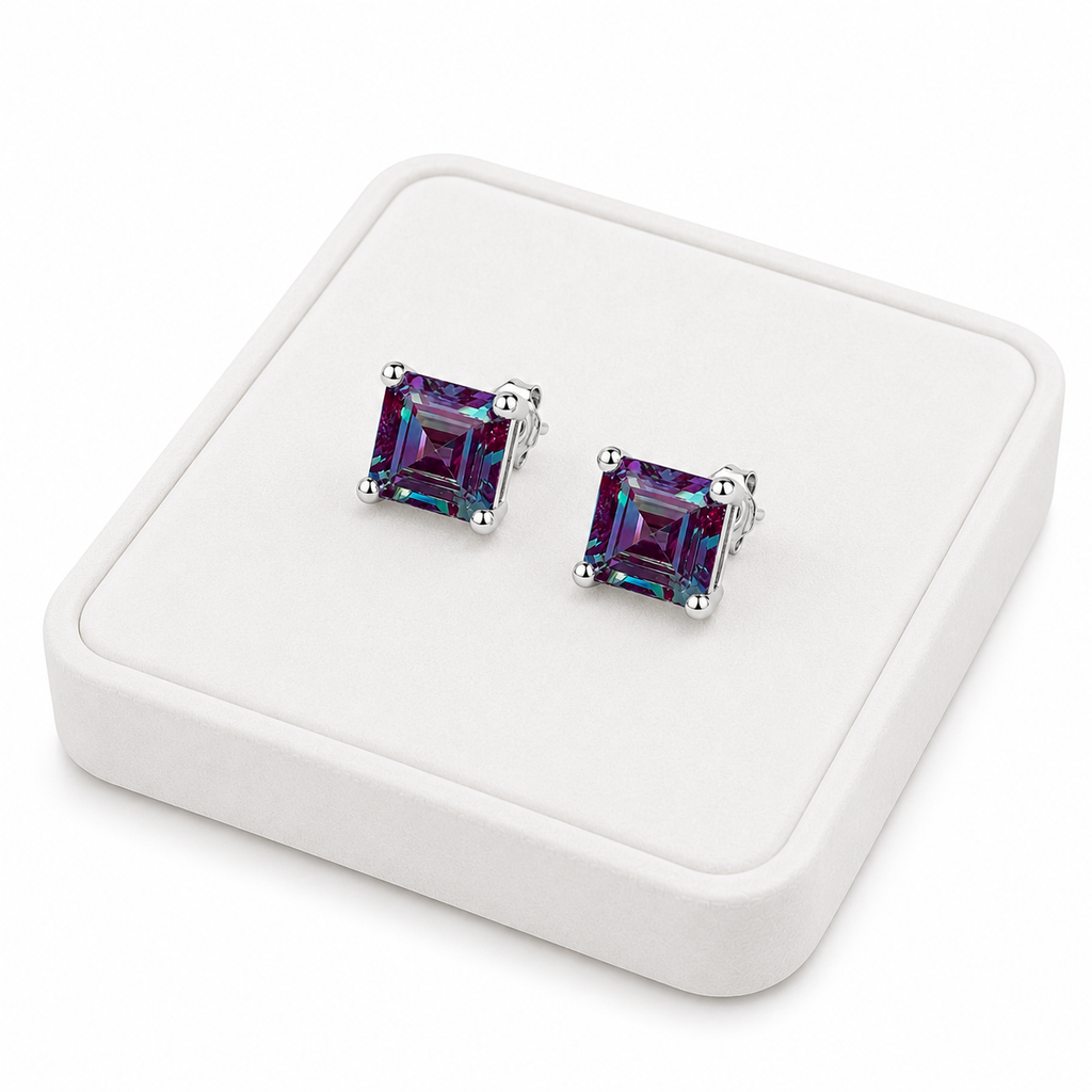 6mm Asscher cut lab alexandrite stud earrings displayed on a white velvet jewelry tray