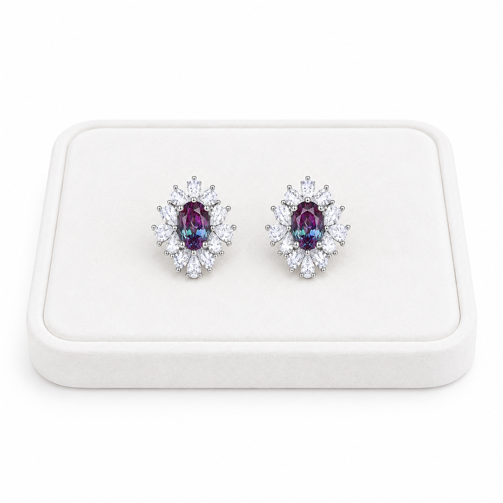 4x6mm oval lab alexandrite floral stud earrings displayed on a white velvet jewelry tray