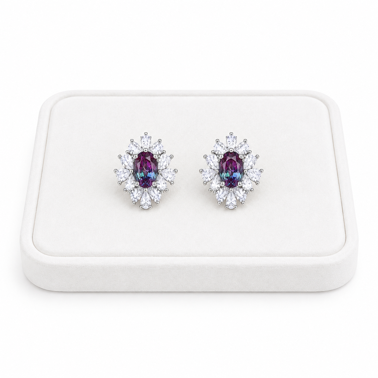 4x6mm oval lab alexandrite floral stud earrings displayed on a white velvet jewelry tray