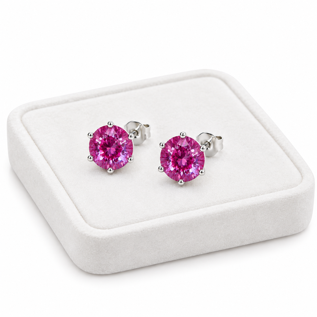 6mm lab created color changing alexandrite heart earrings displayed on white velvet jewelry tray